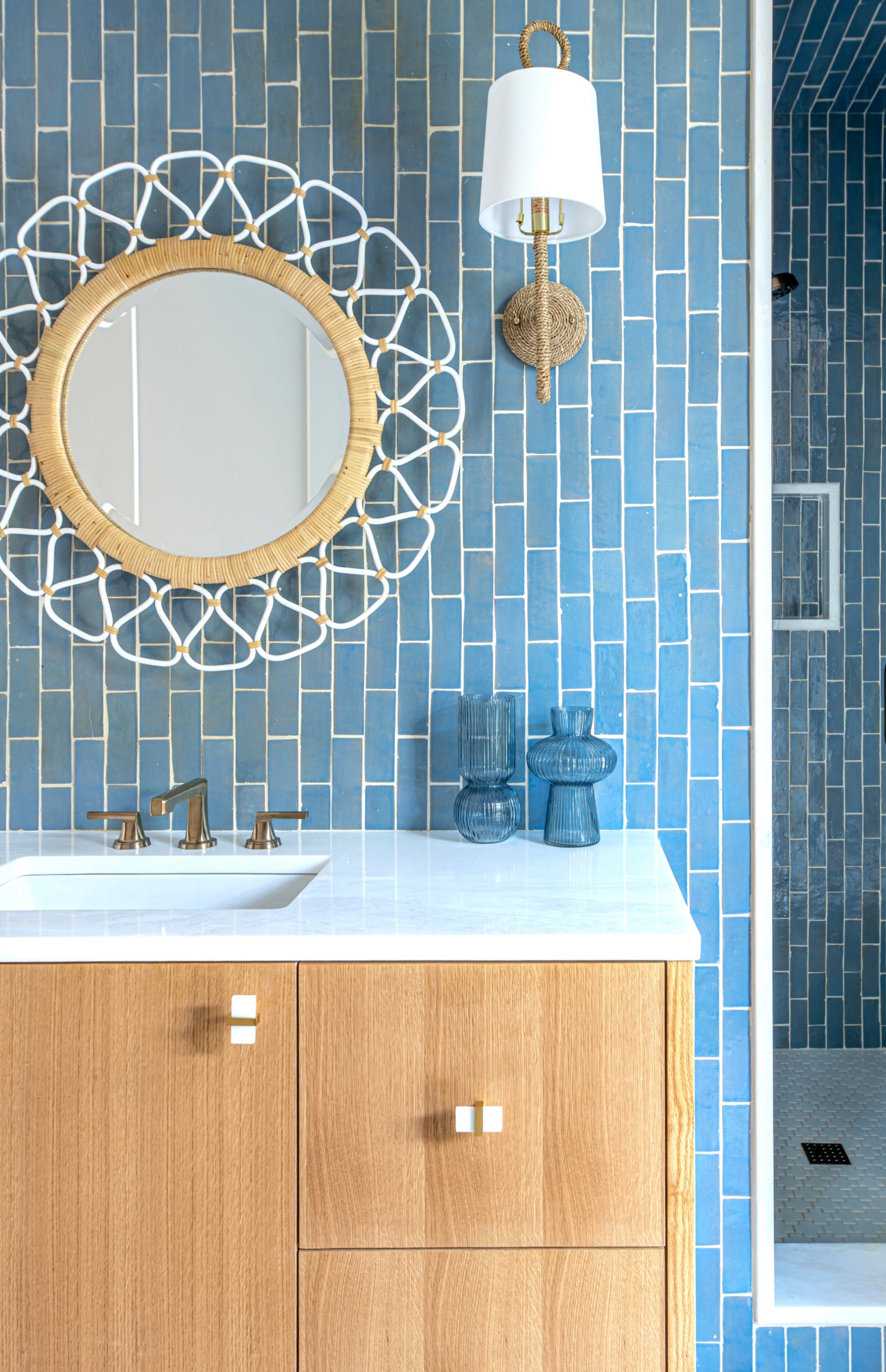 blue rectangle zellige tile installed on the wall and in the shower in a bathroom