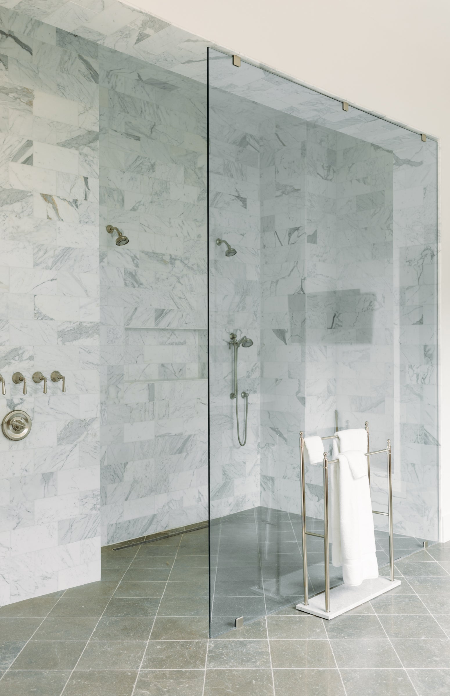 marble and limestone tile installed in shower
