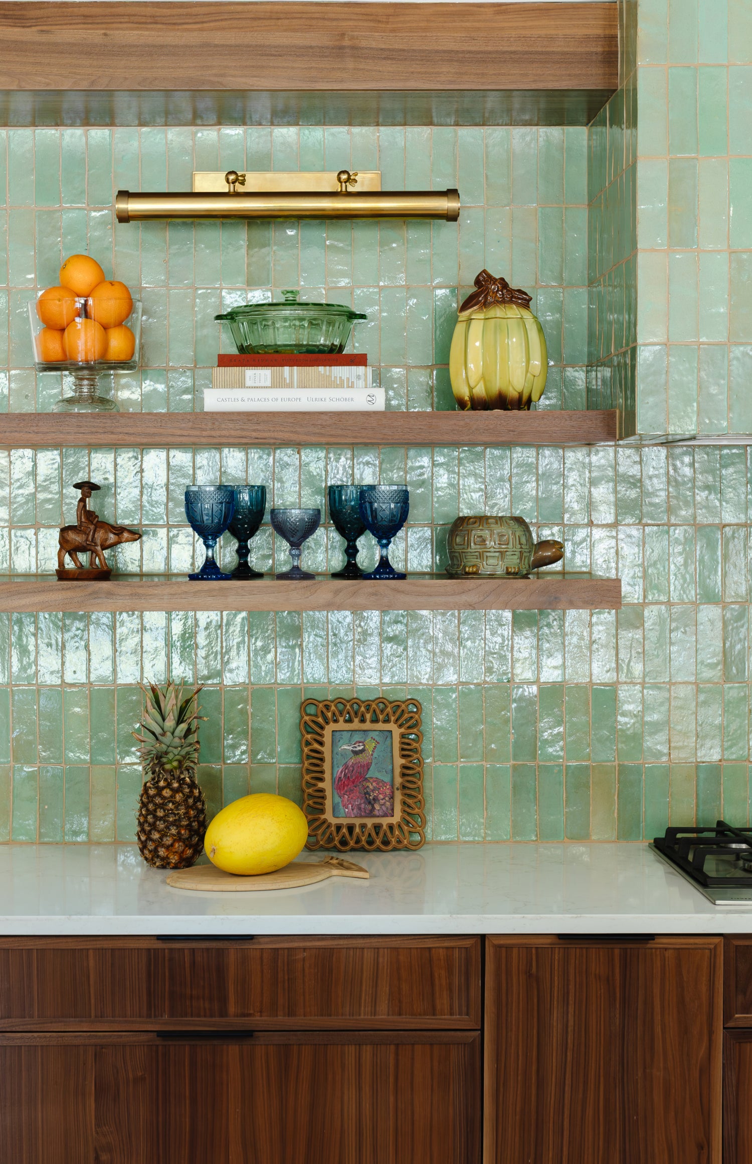 green rectangle zellige tile installed as backsplash in kitchen with floating shelves