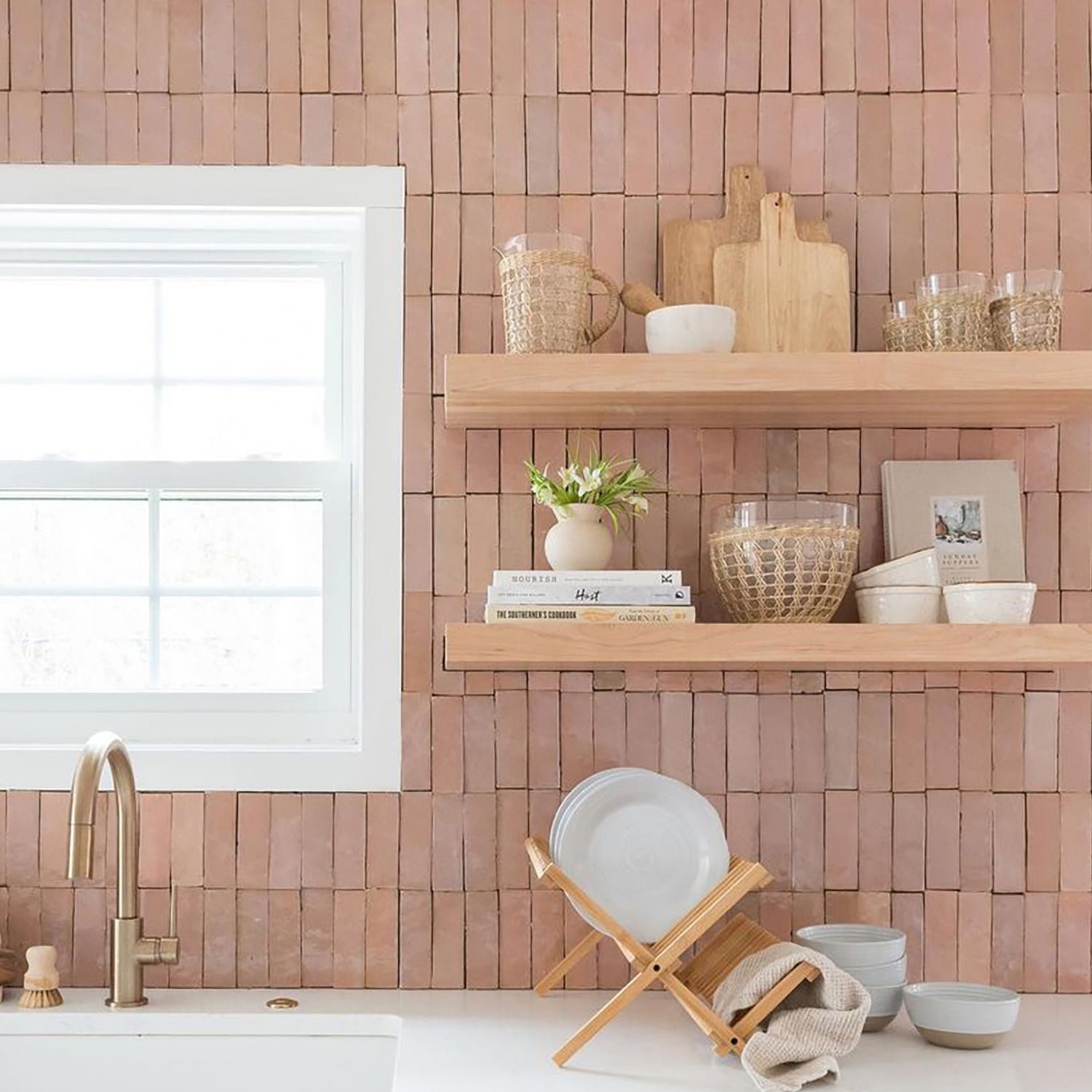 Modern kitchen with wooden wall paneling, shelves, and kitchenware.