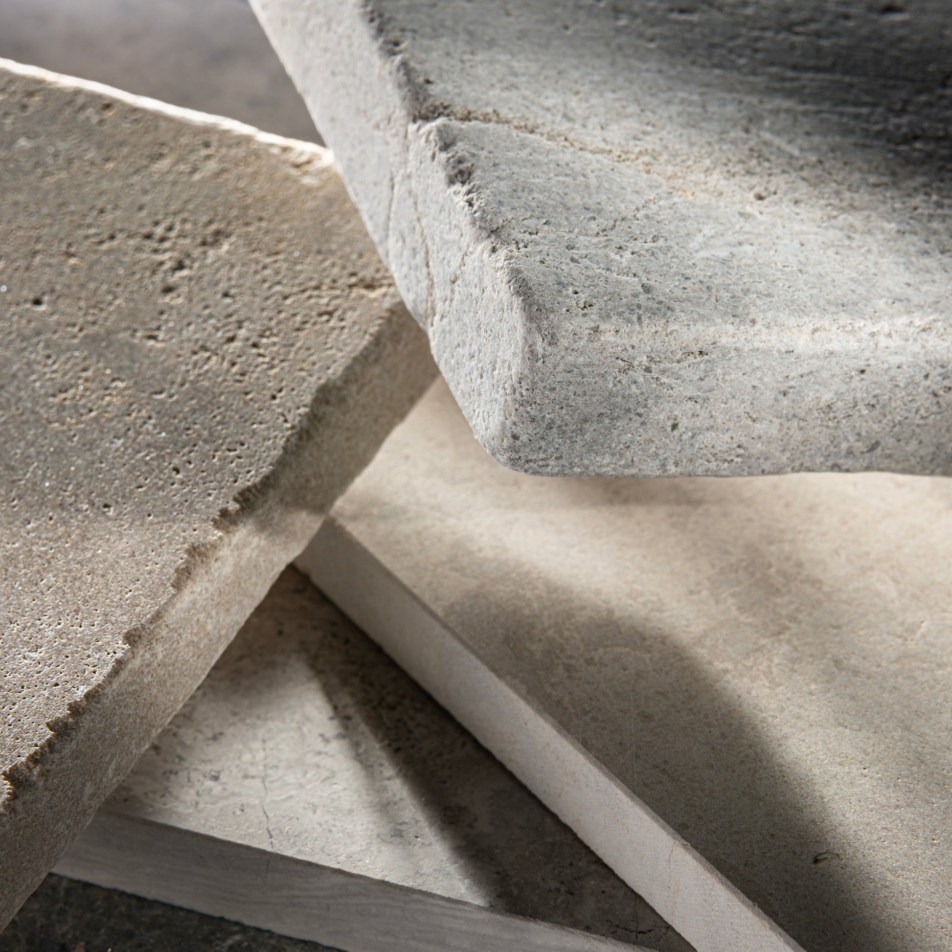 Close-up of limestone tile with a focus on texture and color.