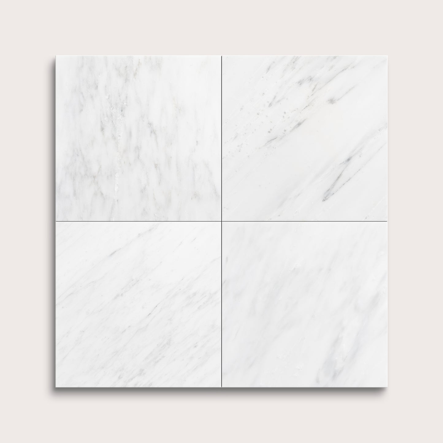 White casablanca carrara marble tiles arranged in a grid pattern on a light gray background