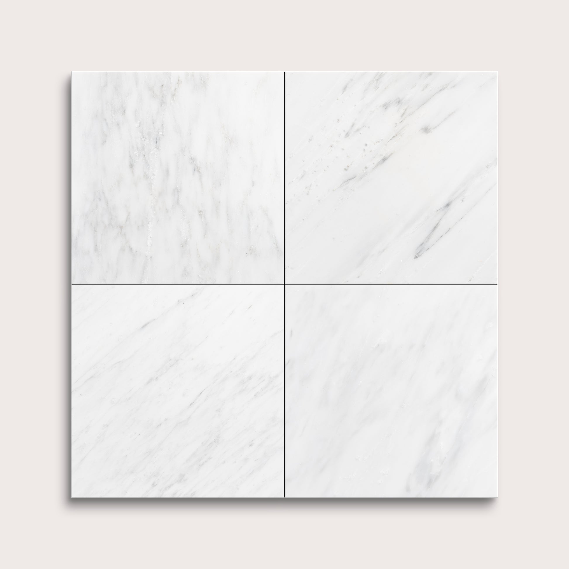 White casablanca carrara marble tiles arranged in a grid pattern on a light gray background