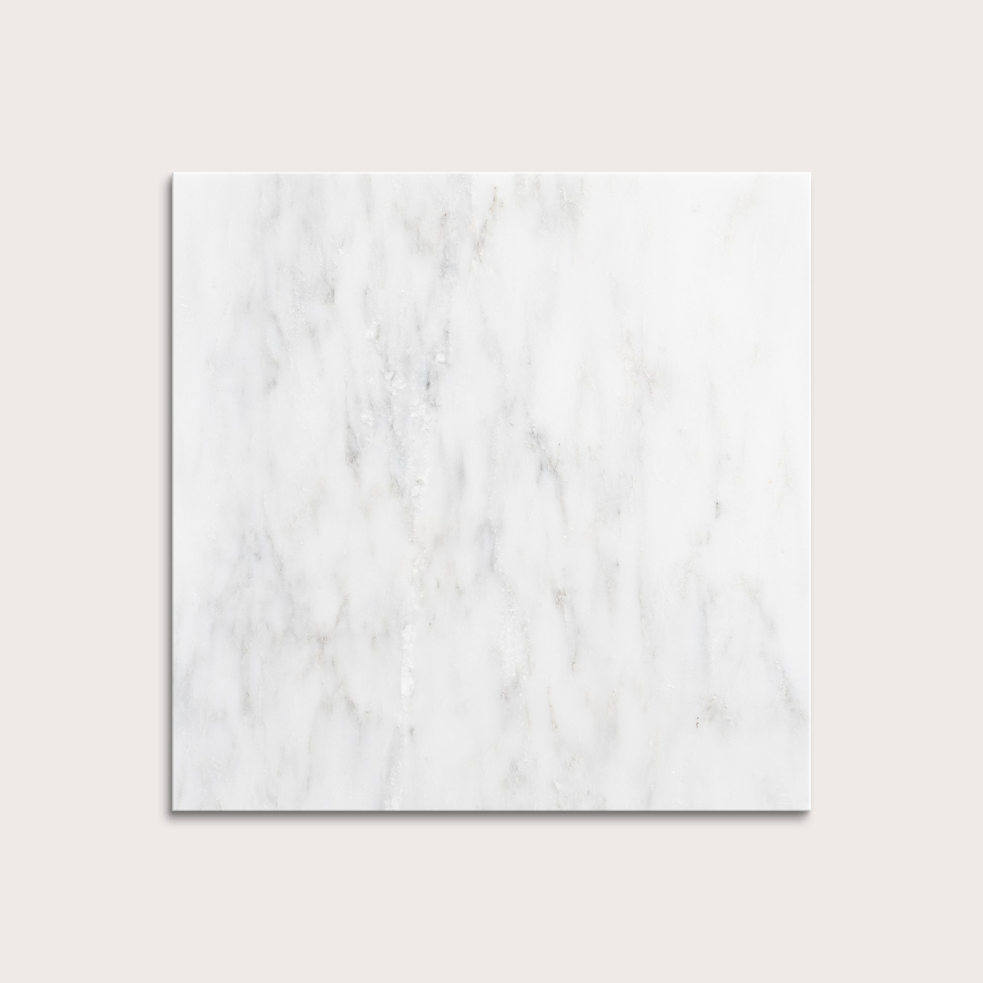 White casablanca carrara marble tiles on a light gray background