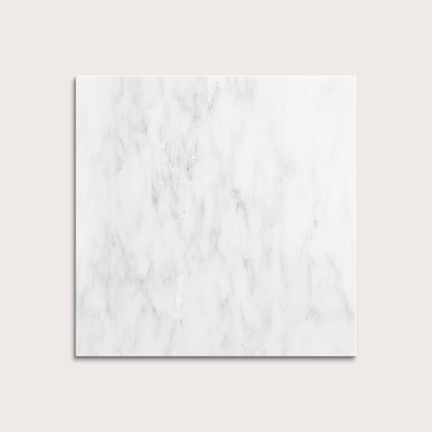 White casablanca carrara marble tiles on a light gray background