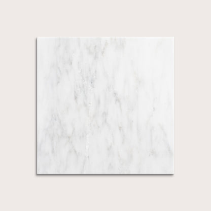 White casablanca carrara marble tiles on a light gray background