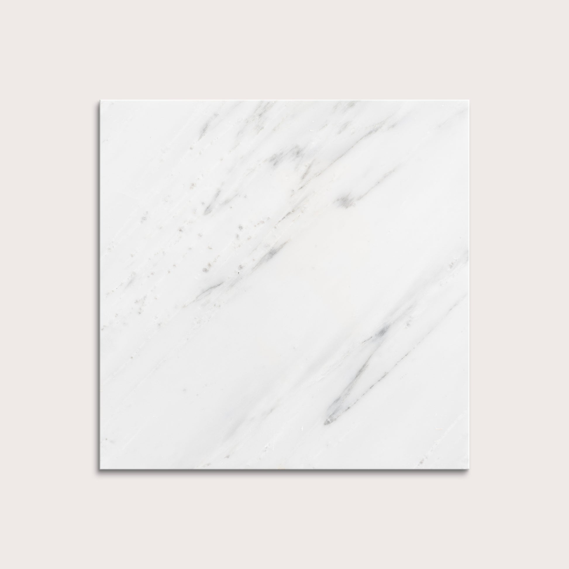 White casablanca carrara marble tiles on a light gray background