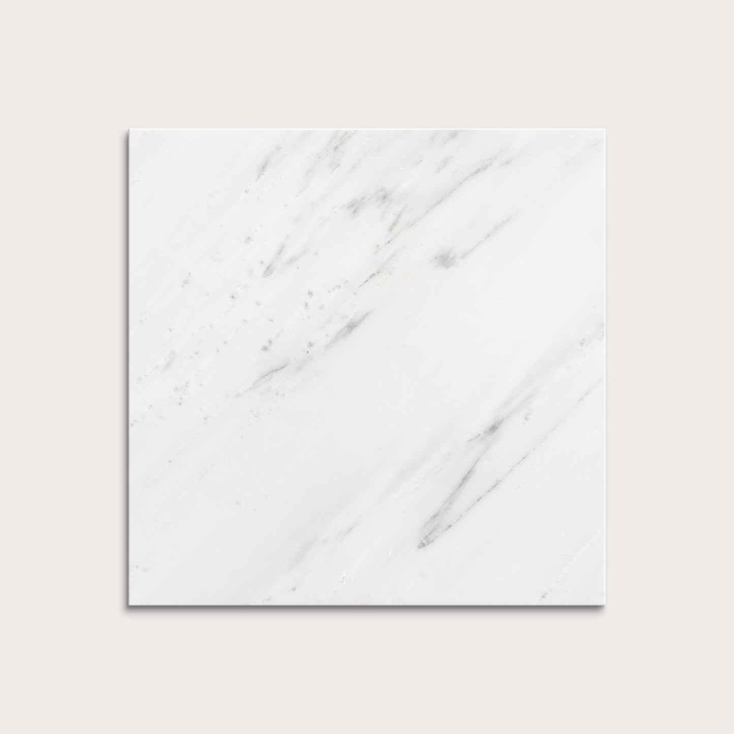 White casablanca carrara marble tiles on a light gray background