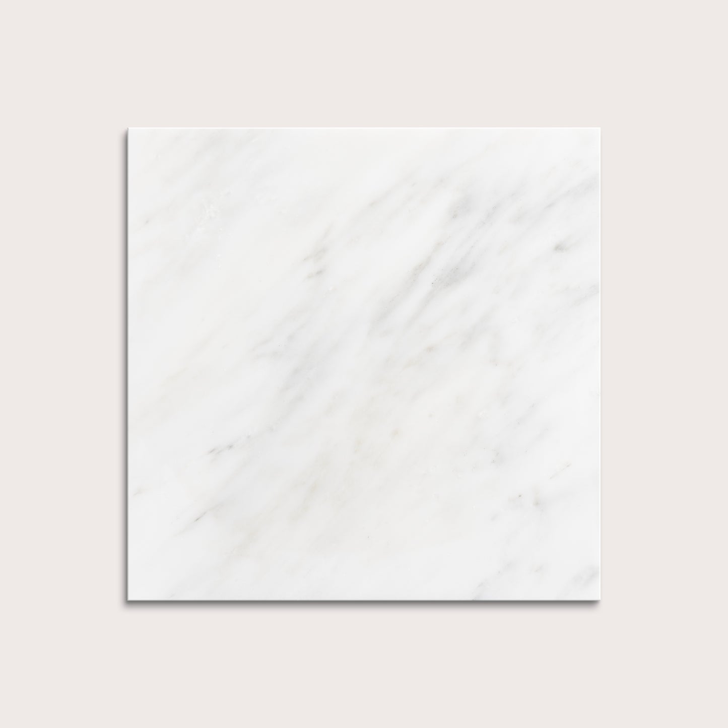 White casablanca carrara marble tiles on a light gray background