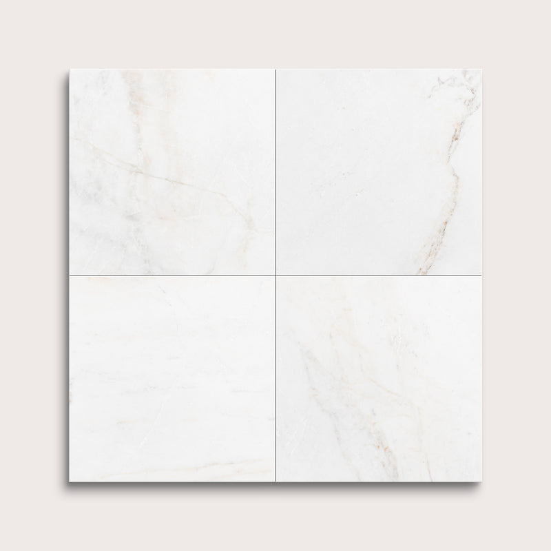 casablanca gold White marble tiles arranged in a grid pattern on a light gray background