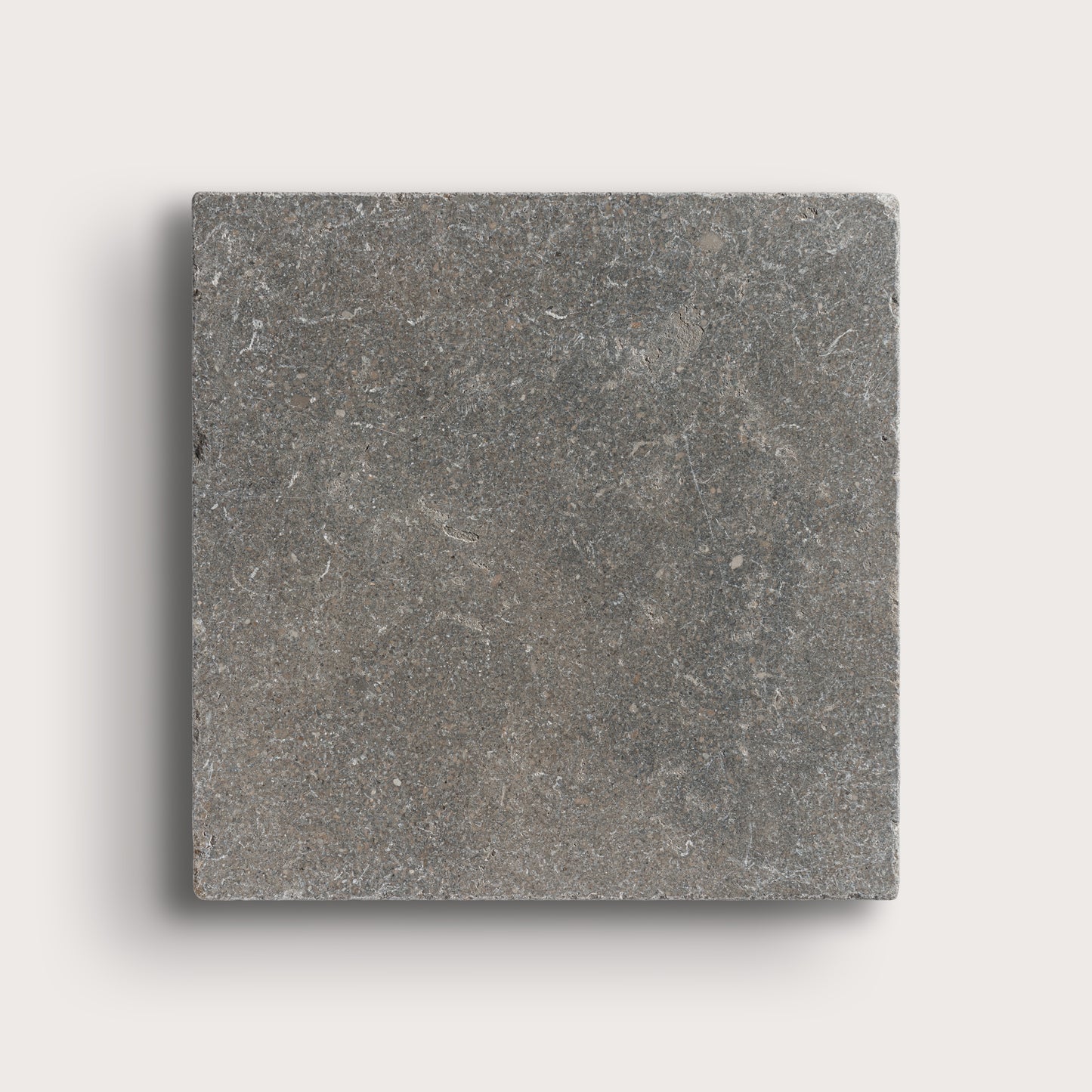 grey square limestone tile on light grey background