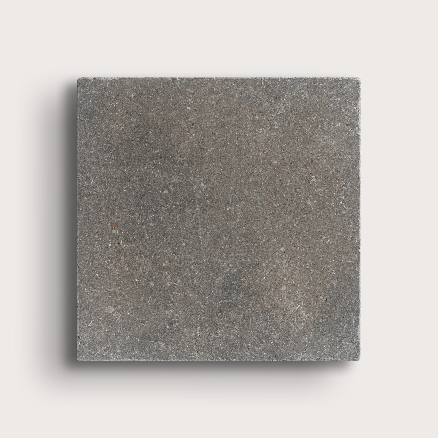 grey square limestone tile on light grey background