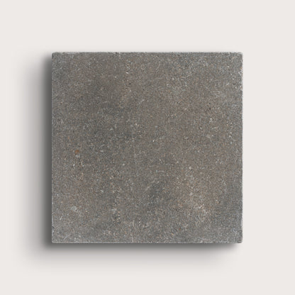 grey square limestone tile on light grey background