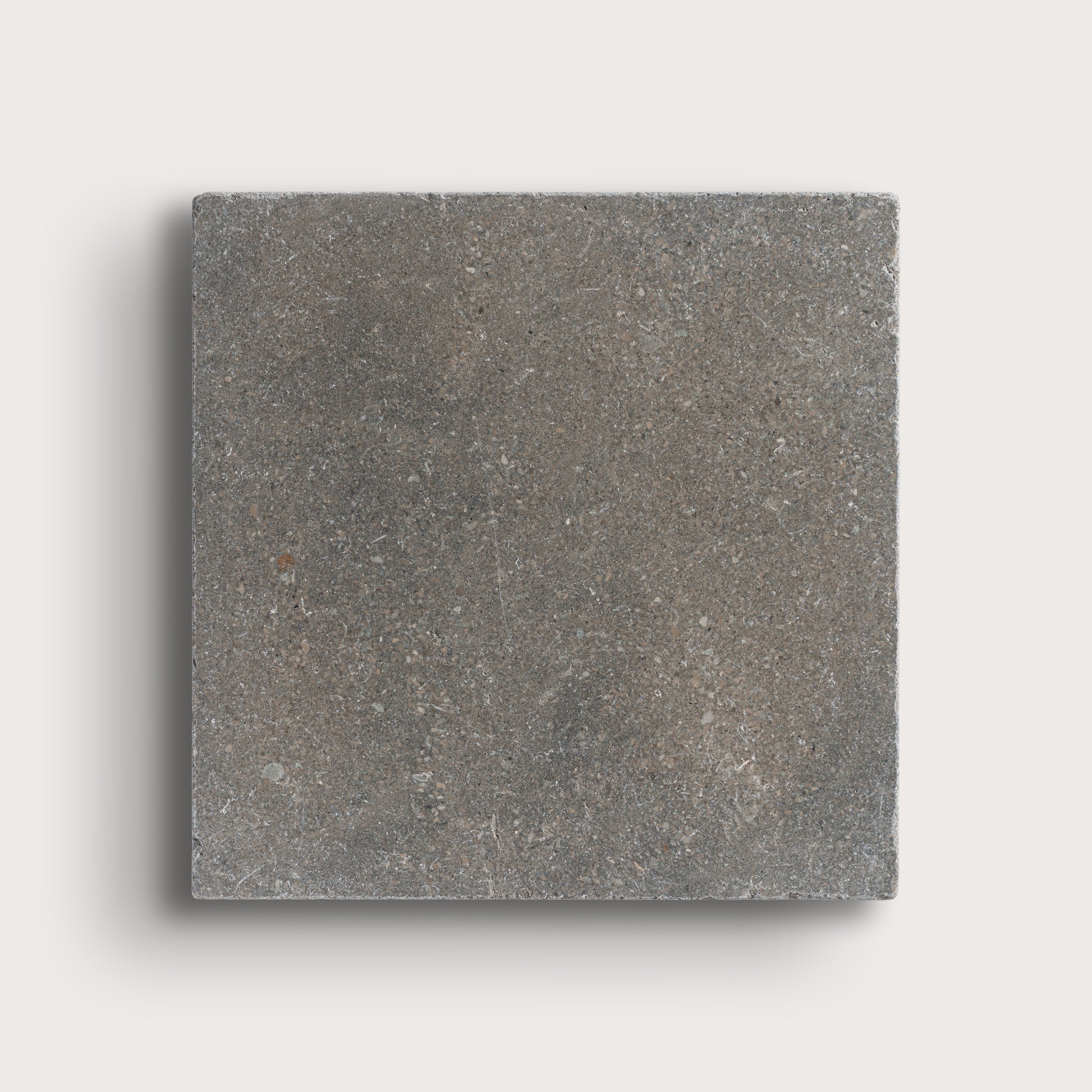 grey square limestone tile on light grey background