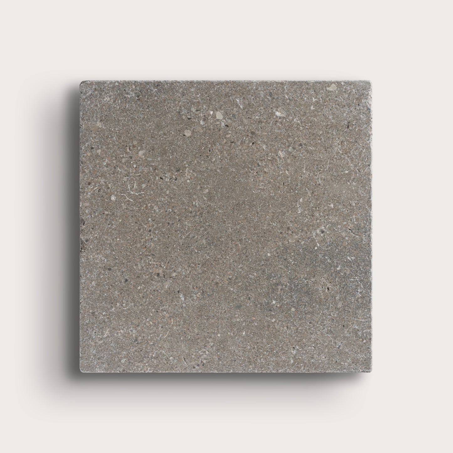 grey square limestone tile on light grey background