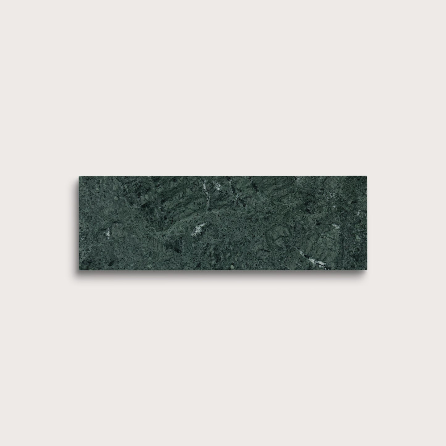 Green marble tile on a light gray background