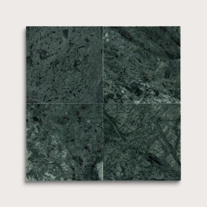 Four square tiles with a dark green marble pattern on a white background