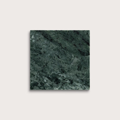 Square tile with a green marble pattern on a light gray background