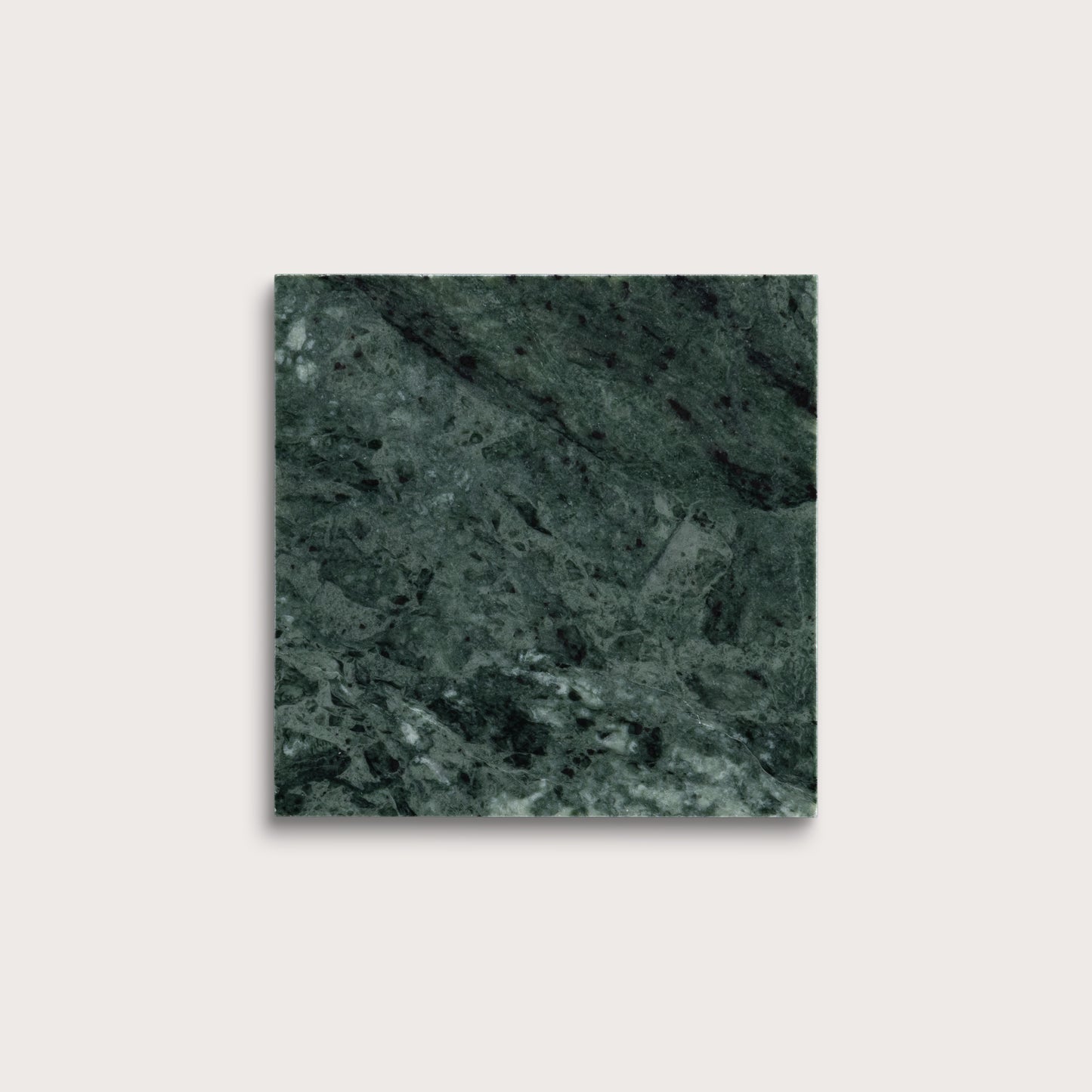 Square tile with a green marble pattern on a light gray background