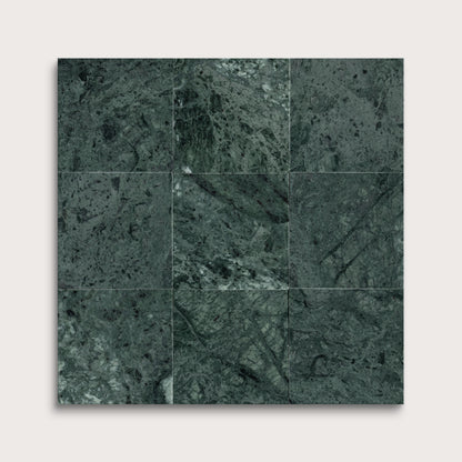 Dark green marble tiles arranged in a grid pattern on a white background