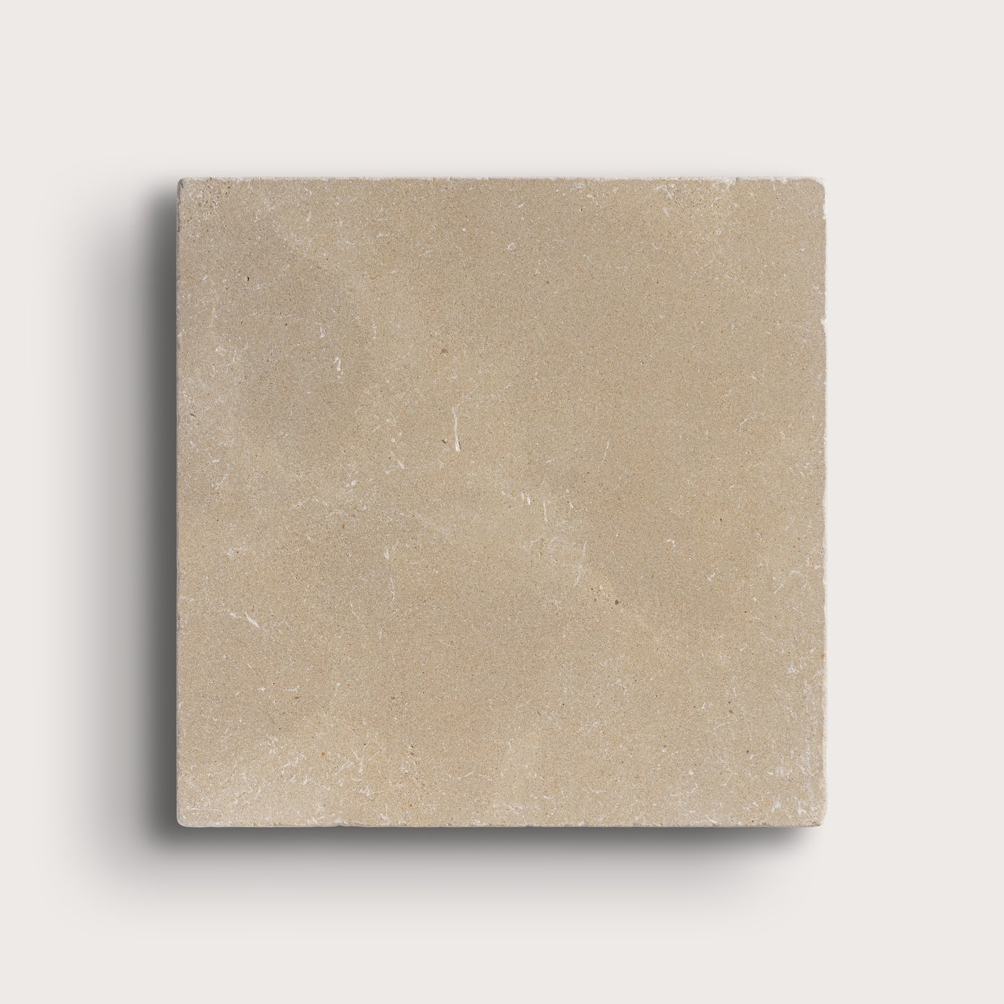 Beige square tile on a light gray background