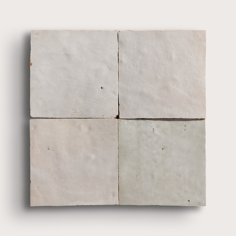 natural white square zellige tile arranged in grid on light grey background