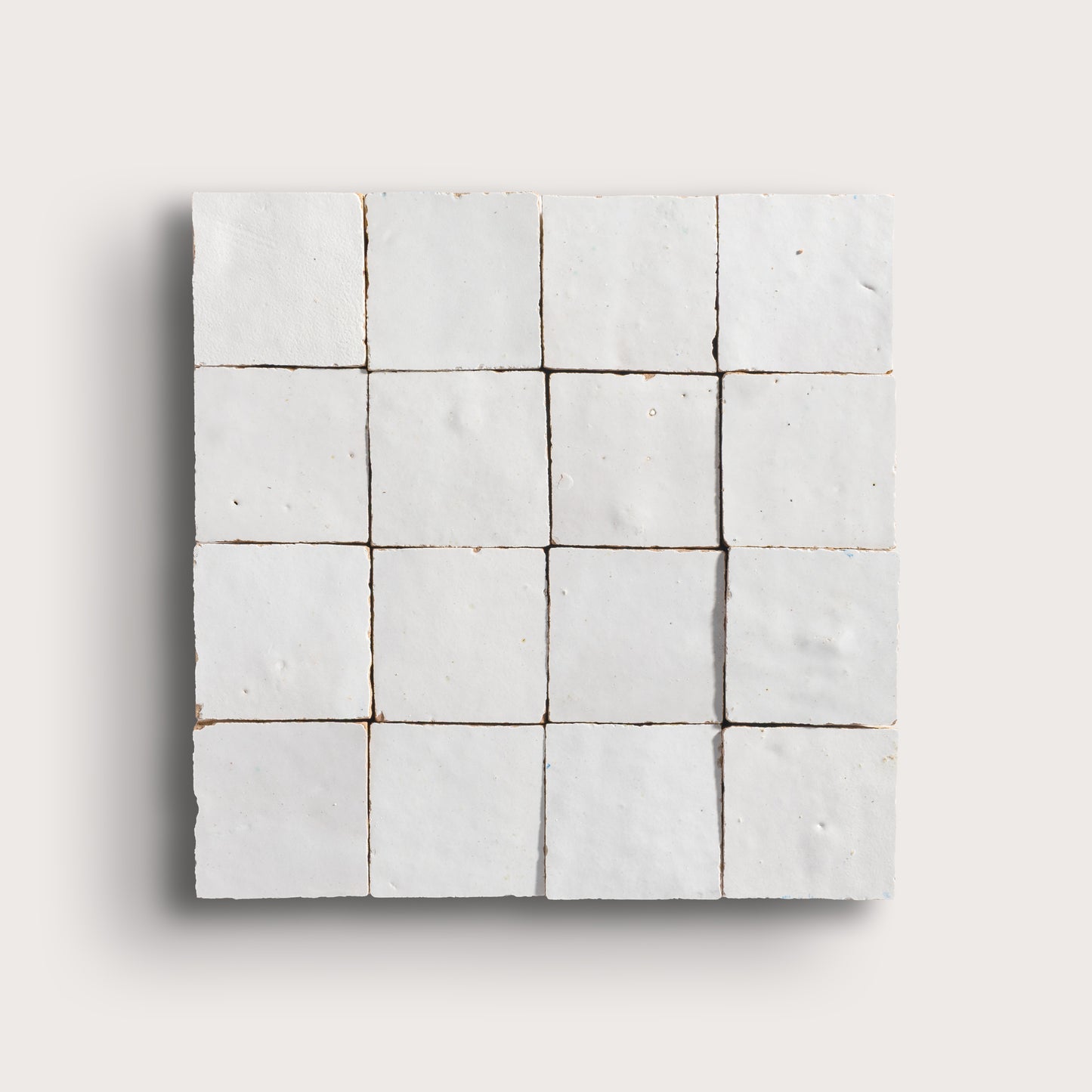 snow white square zellige tile on a light grey background