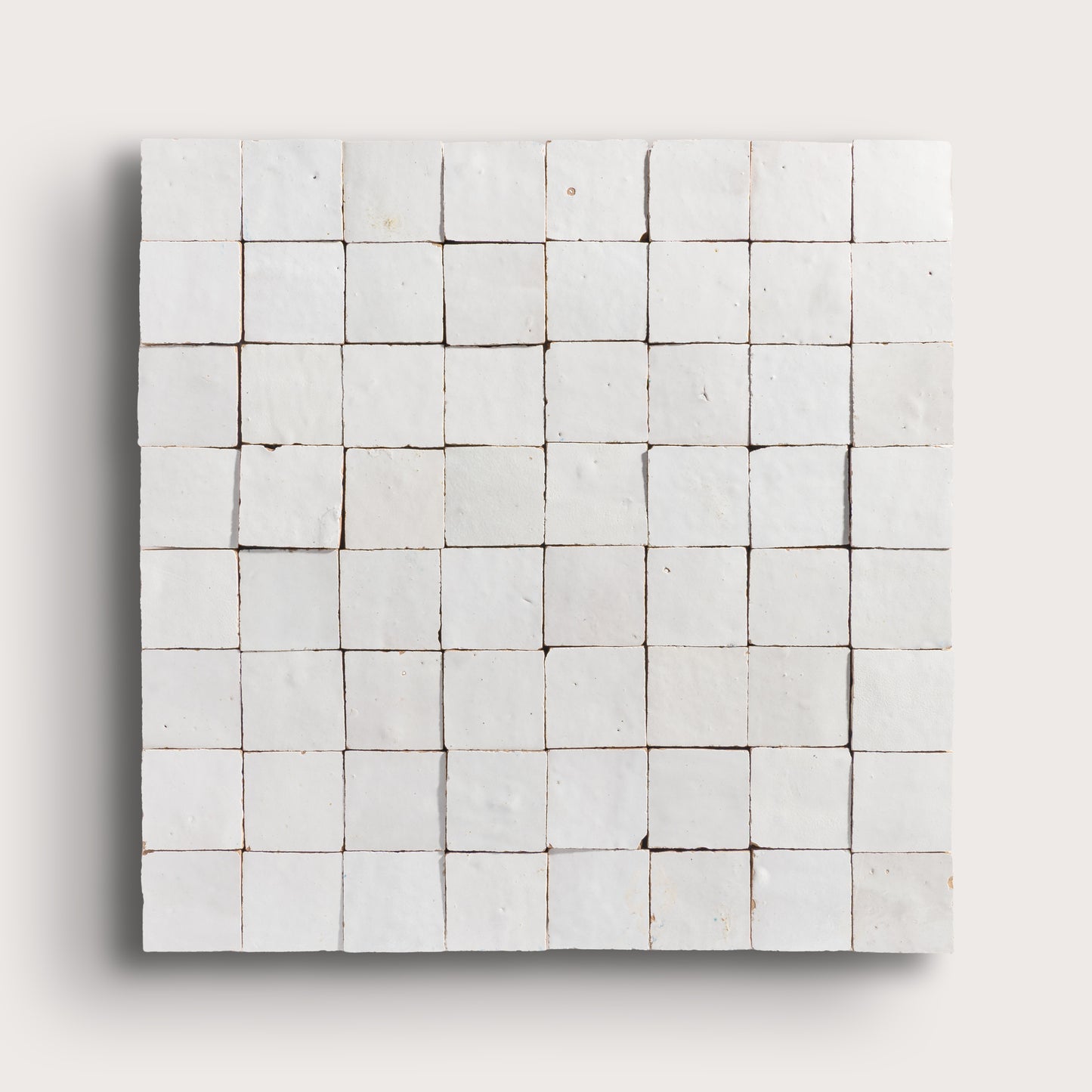 snow white square zellige tile on a light grey background